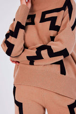 Not Shy Iwar Sweater in Black and Tan